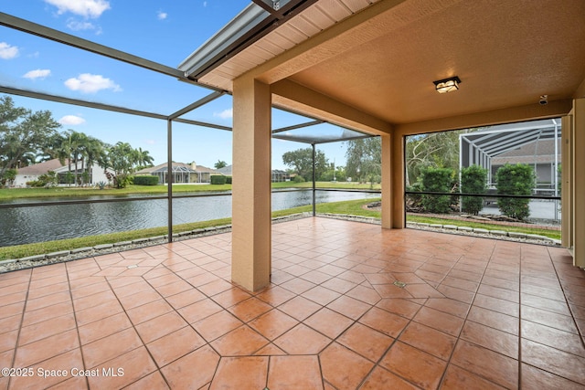 unfurnished sunroom with a water view