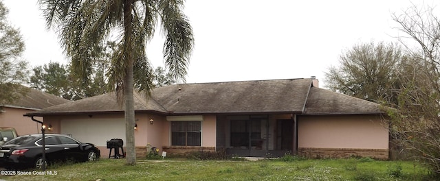 rear view of property with a yard