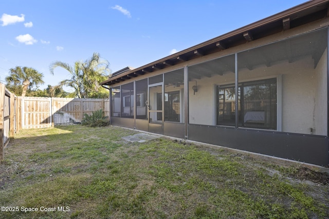 view of yard featuring a sunroom