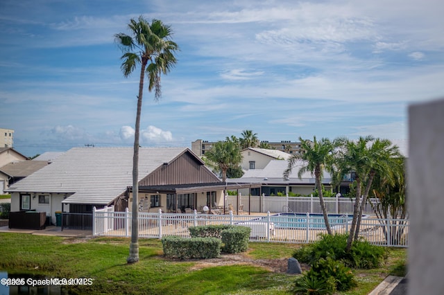 view of pool featuring a patio area and a lawn