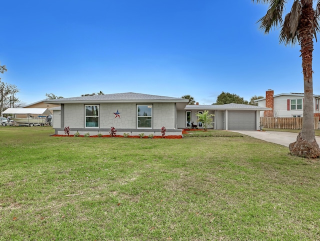 ranch-style home with a front yard and a garage