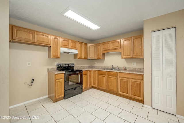 kitchen featuring light tile patterned floors, electric range, and sink