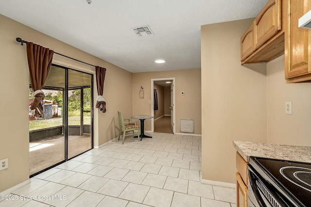 kitchen with light tile patterned floors