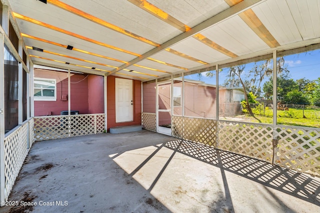 unfurnished sunroom featuring plenty of natural light