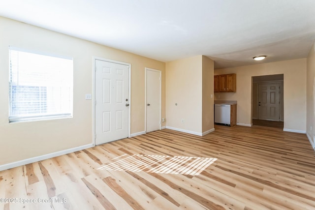 unfurnished living room with light wood-type flooring