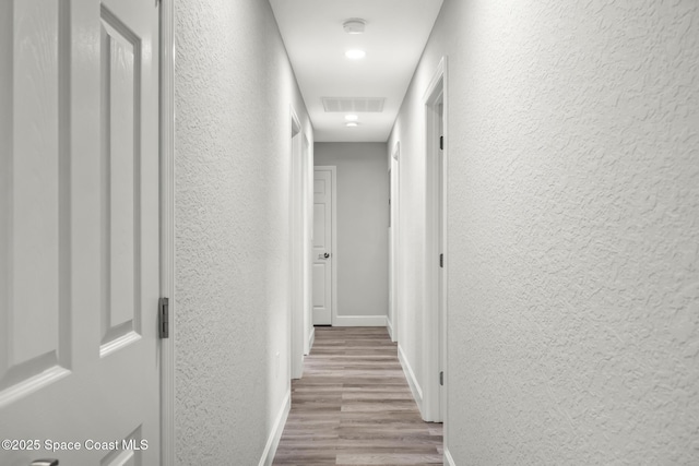 hall featuring light hardwood / wood-style flooring