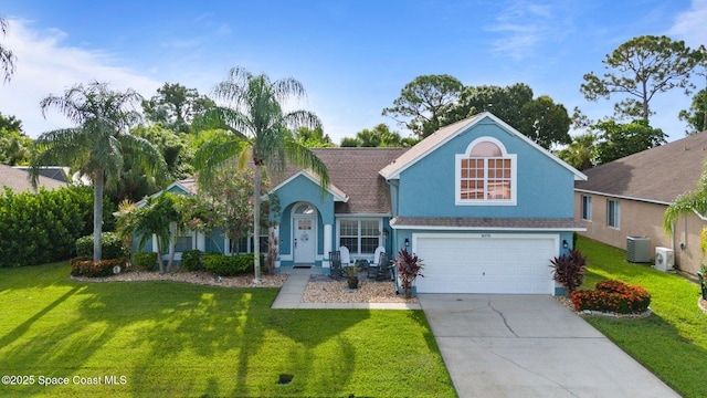 view of front of property featuring central AC unit, a garage, and a front lawn