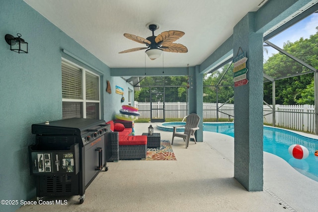 view of pool featuring a lanai, outdoor lounge area, ceiling fan, and a patio