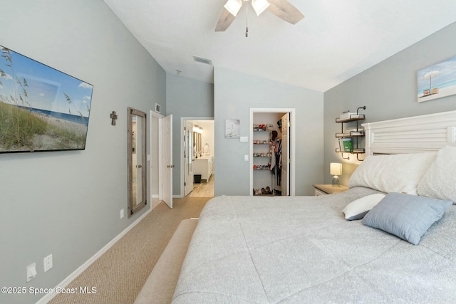 bedroom with carpet flooring, ceiling fan, a spacious closet, connected bathroom, and a closet