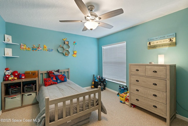 carpeted bedroom with ceiling fan