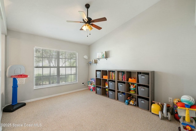 game room featuring carpet flooring, vaulted ceiling, and ceiling fan