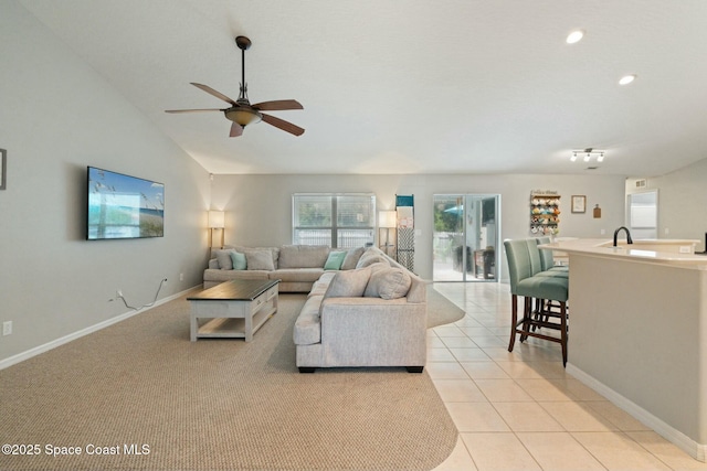 tiled living room with ceiling fan