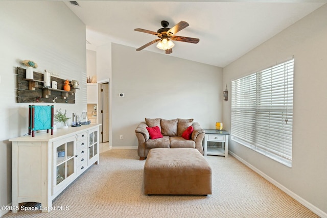 carpeted living room with ceiling fan