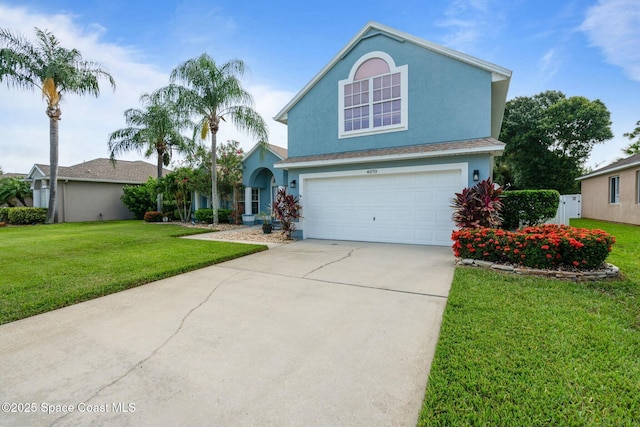 front of property featuring a garage and a front lawn