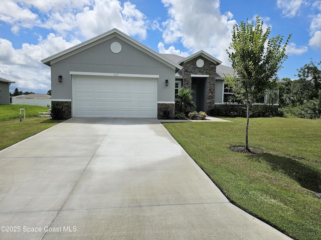 view of front of house with a garage and a front yard