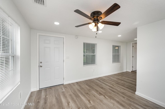 entrance foyer with hardwood / wood-style flooring and ceiling fan