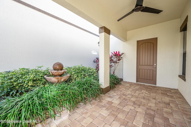 exterior space featuring ceiling fan