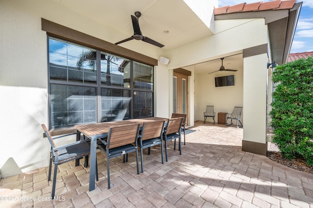 view of patio featuring ceiling fan