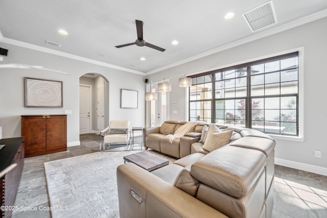 living room with light tile patterned floors, ceiling fan, and ornamental molding