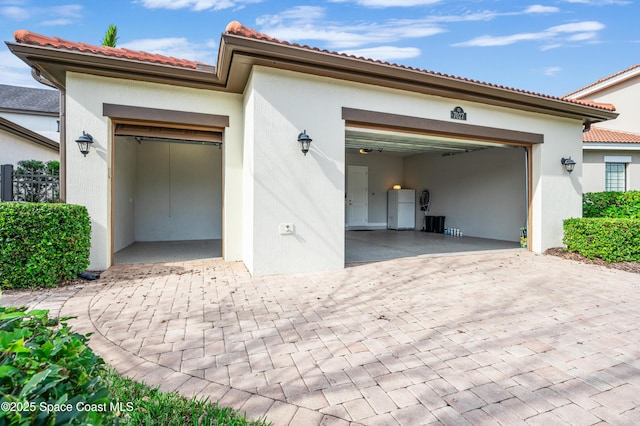 garage featuring white refrigerator