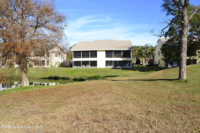 view of yard featuring a sunroom