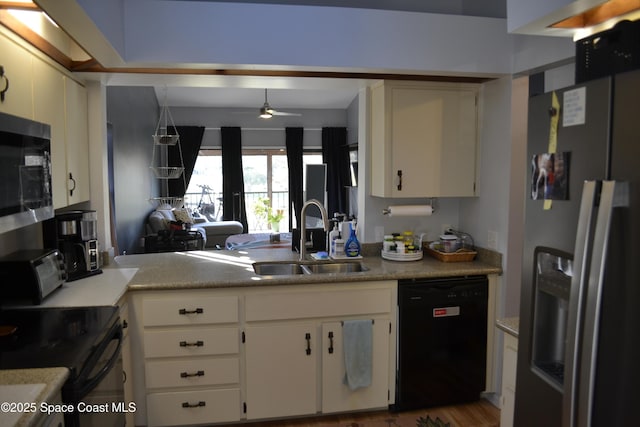 kitchen featuring black appliances, ceiling fan, white cabinetry, and sink