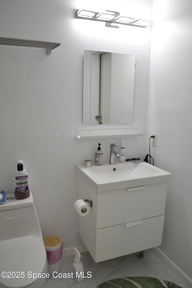 bathroom with vanity and toilet