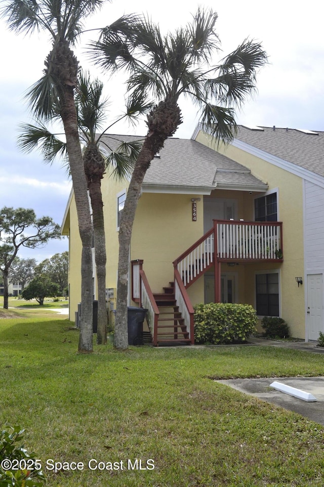 view of property exterior featuring a lawn