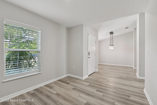 unfurnished room with light hardwood / wood-style flooring