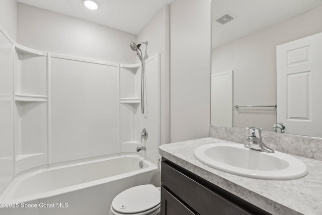 full bathroom featuring shower / tub combination, vanity, a textured ceiling, and toilet