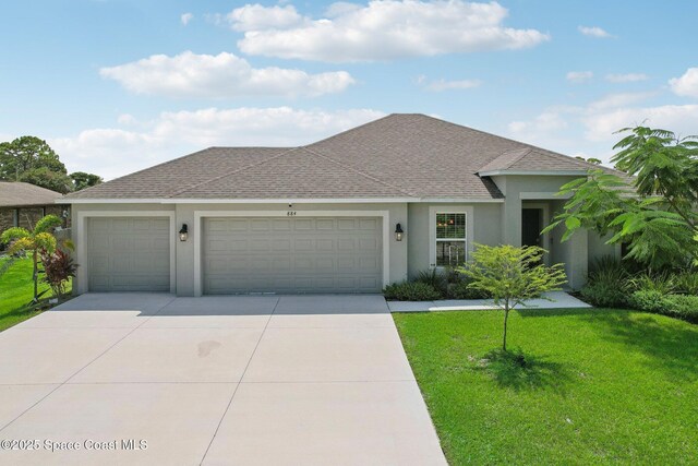 single story home with a front lawn and a garage