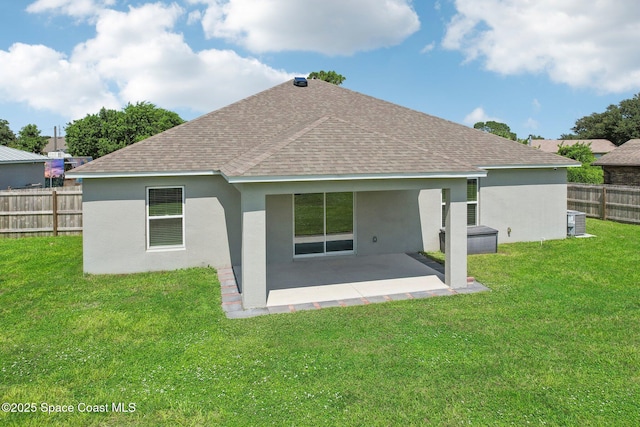 back of house with a yard, a patio, and central AC unit