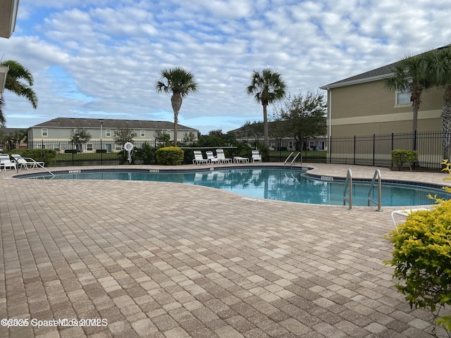 view of swimming pool with a patio area