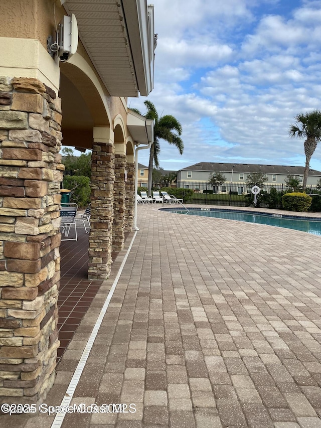 view of patio with a community pool