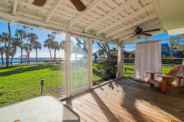 unfurnished sunroom featuring beam ceiling, a water view, and wood ceiling