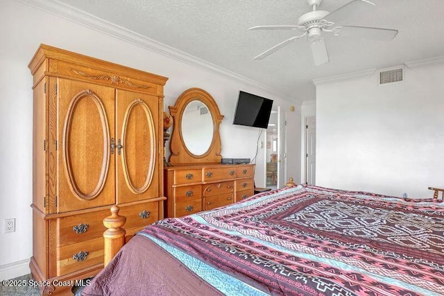 bedroom with a textured ceiling, ceiling fan, and crown molding