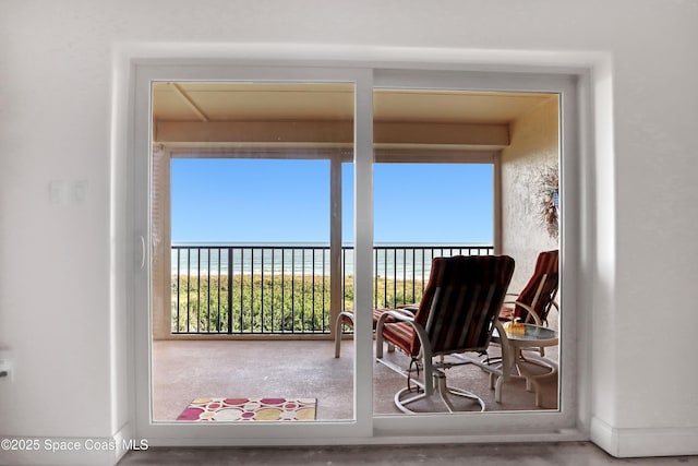 balcony featuring a water view