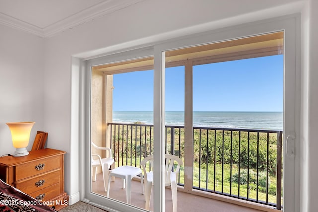 entryway with a water view, a beach view, and ornamental molding