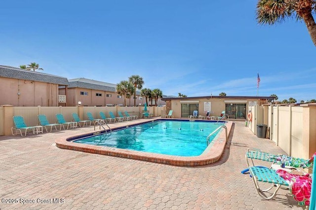 view of swimming pool with a patio area