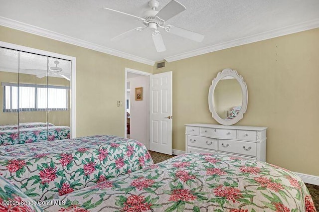 bedroom with a textured ceiling, ceiling fan, and crown molding