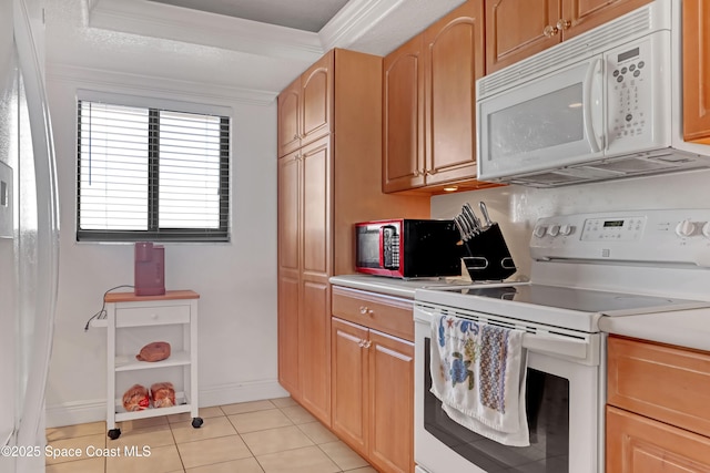 kitchen featuring light tile patterned floors, white appliances, and ornamental molding