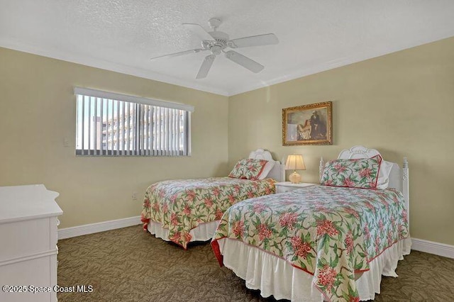 bedroom featuring dark colored carpet, a textured ceiling, and ceiling fan