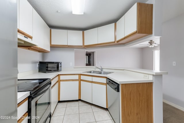 kitchen with kitchen peninsula, sink, white cabinets, and black appliances