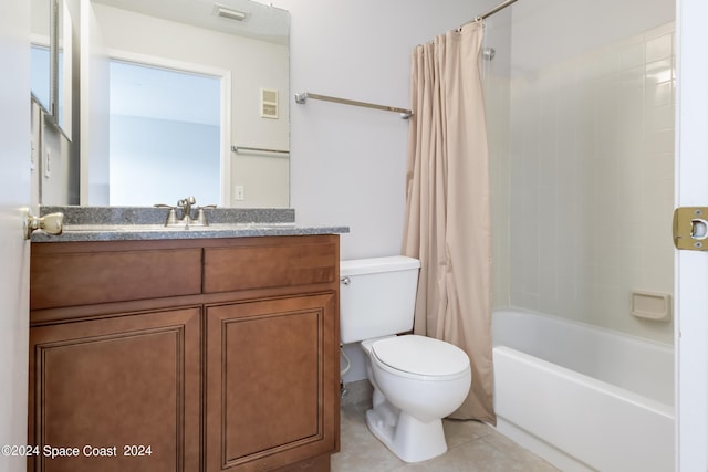 full bathroom featuring shower / tub combo, vanity, toilet, and tile patterned floors