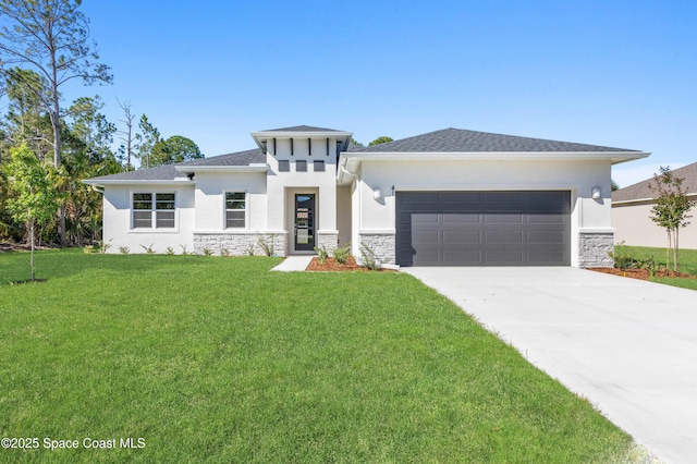 prairie-style home with a garage and a front lawn