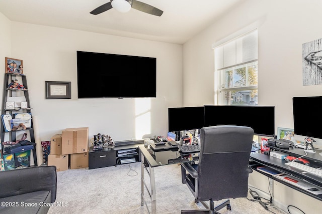 office area with ceiling fan and light carpet