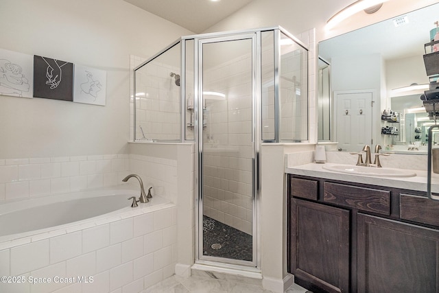 bathroom featuring vanity and plus walk in shower