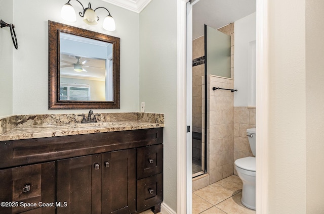 bathroom with vanity, a shower with door, tile patterned floors, crown molding, and toilet