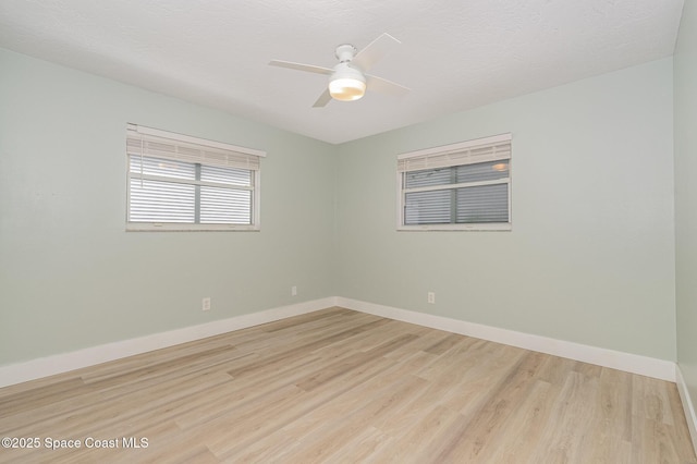 unfurnished room with light hardwood / wood-style floors and ceiling fan