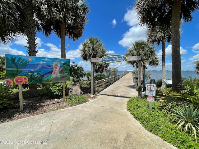 surrounding community featuring a water view